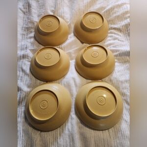 Vintage cereal or Tupperware salad bowls of "Harvest Gold" color.